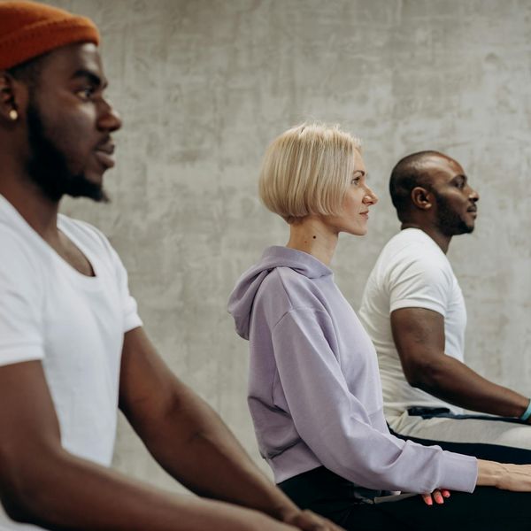 Group of diverse people enjoying a yoga class together.